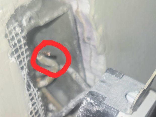 Electrical defect circled in red marker for the customer's documentation